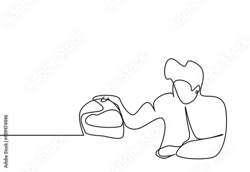 person whose arm is broken and tied after motorcycle accident sits and thinks