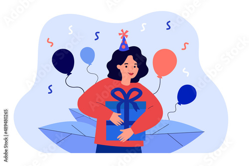 Happy cartoon woman in party hat holding gift box. Confetti and balloons, girl getting birthday present or bonus flat vector illustration. Birthday, celebration concept for banner or landing web page