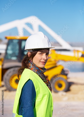 Im the foreWOMAN. Portrait of an attractive young construction worker on site.