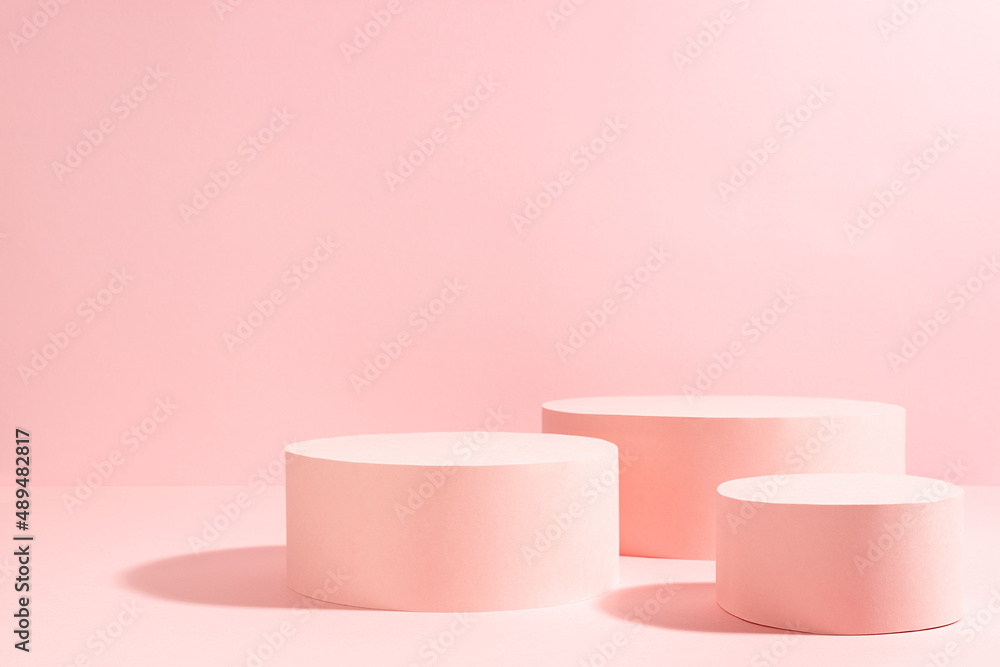 Bright pastel pink three different circle podiums in sunlight with shadow mockup for presentation cosmetic product or goods, copy space. Romantic template for advertising, design, show, display. Bright pastel pink three different circle podiums in sunlight with shadow mockup for presentation cosmetic product or goods, copy space. Romantic template for advertising, design, show, display.