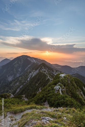 Fototapeta Naklejka Na Ścianę i Meble -  View from the peak of the Herzogstand in Bavaria Germany with a colorful sunset