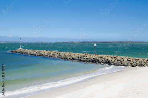 A Calm blue ocean waters with rocky coast of Dolls Point Beach, Brighton Le Sands, Sydney, Australia.