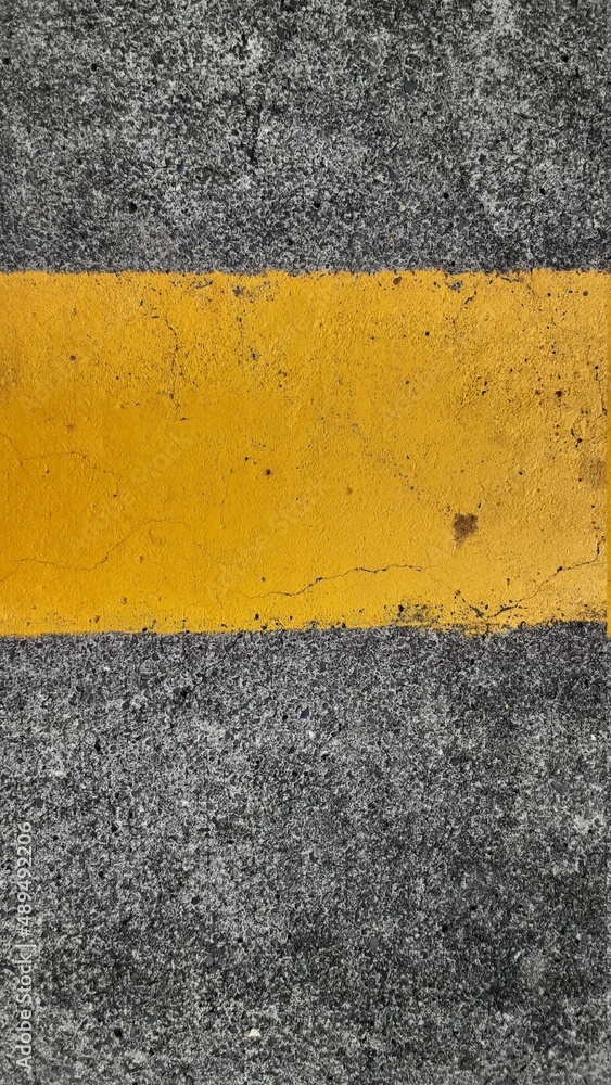Road texture with yellow line marking