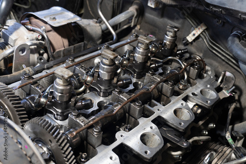 Selective one of engine injector of car. Open the lid for maintenance and cleaning of soot.