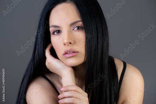 Young brunette woman with beautiful clean skin 