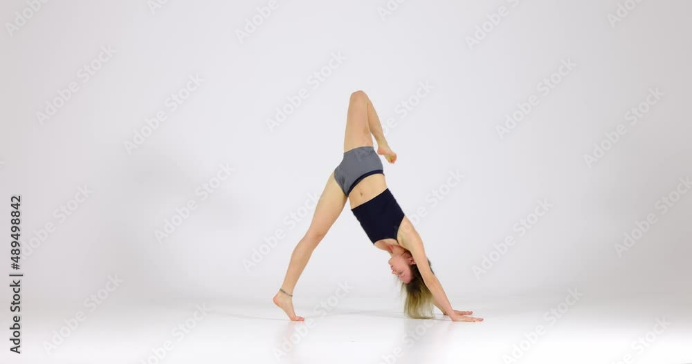 Blonde woman doing yoga exercise in studio closeup Blonde woman doing yoga exercise in studio closeup