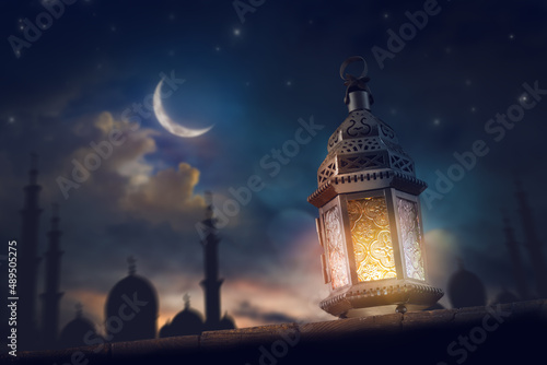 Ornamental Arabic lantern with burning candle photo
