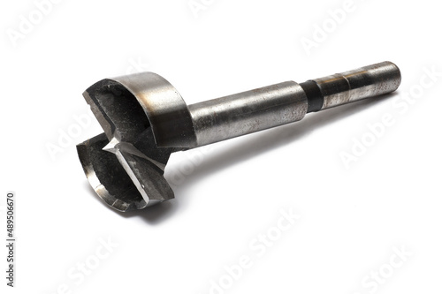 Closeup steel Forstner drill tool white background