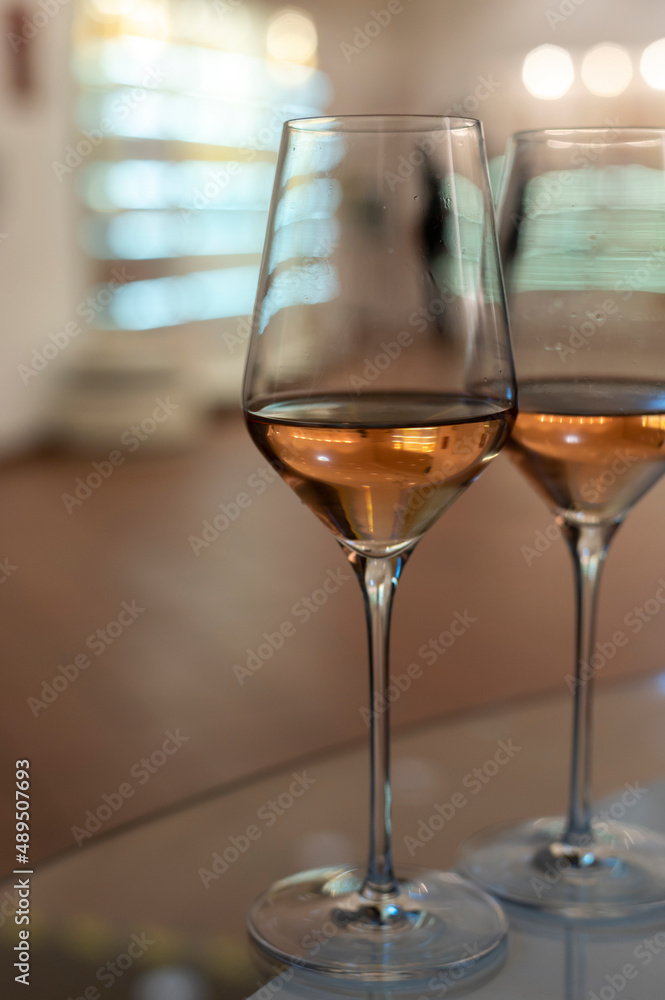 Obraz premium Tasting of brut champagne sparkling wine produced by traditional method in underground caves