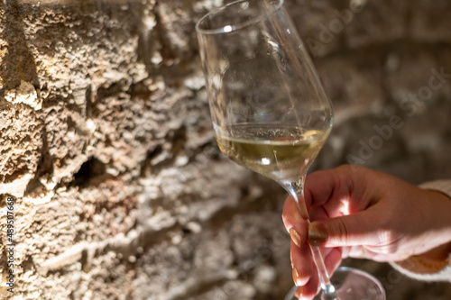 Photography Tasting of brut champagne sparkling wine produced by traditional method in under