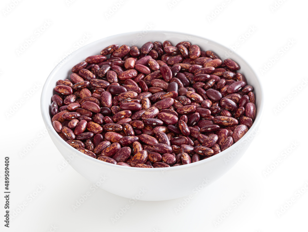 Red pinto beans in white bowl isolated on white background with clipping path Red pinto beans in white bowl isolated on white background with clipping path