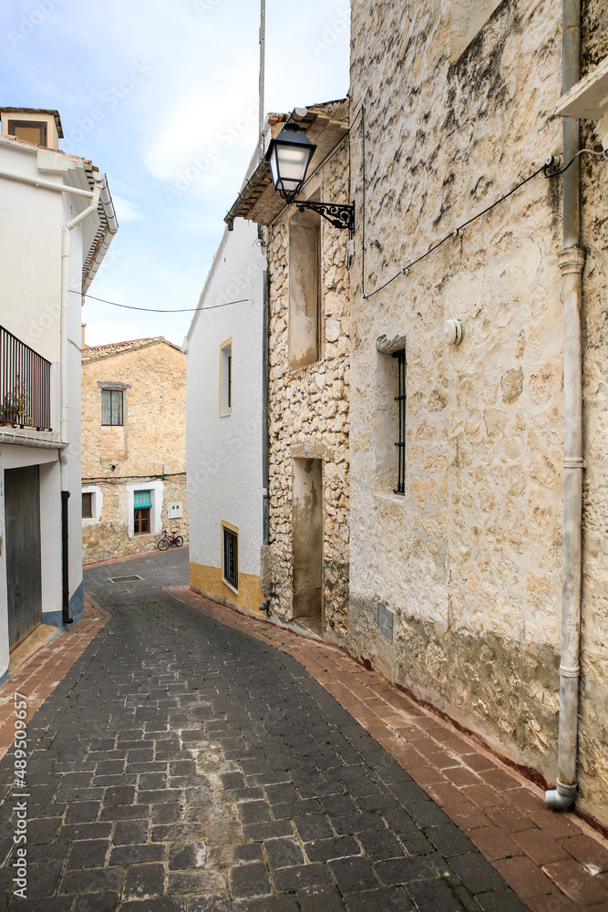 Narrow street and typical facades of Benifato village