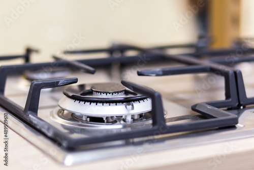 Gas stove burner close-up on a blurred background