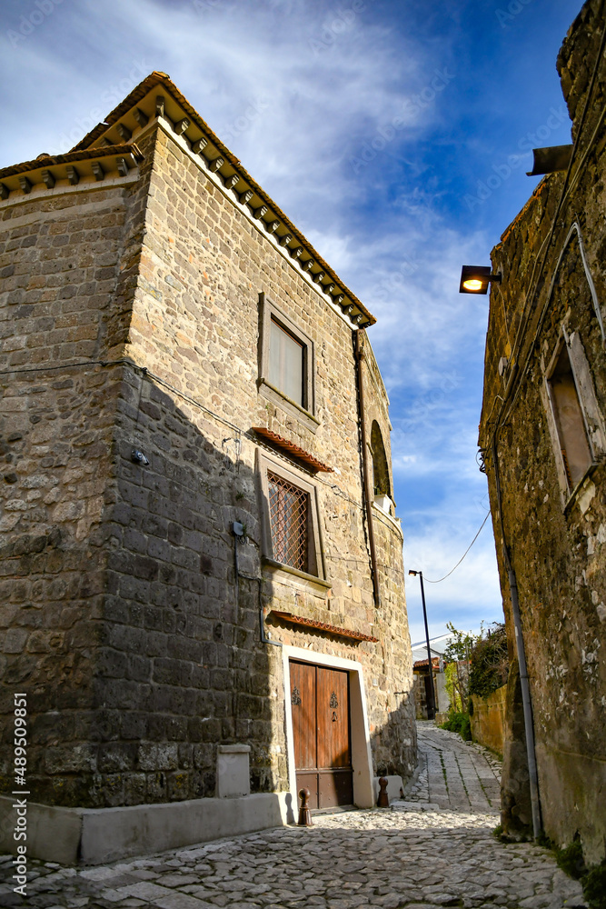 A narrow street among the old stone houses of the oldest district of the city of Caserta.