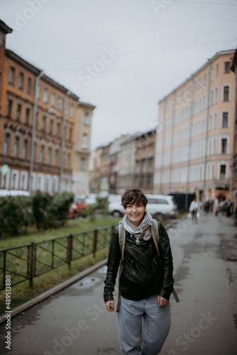 Woman walking in the city and smiling