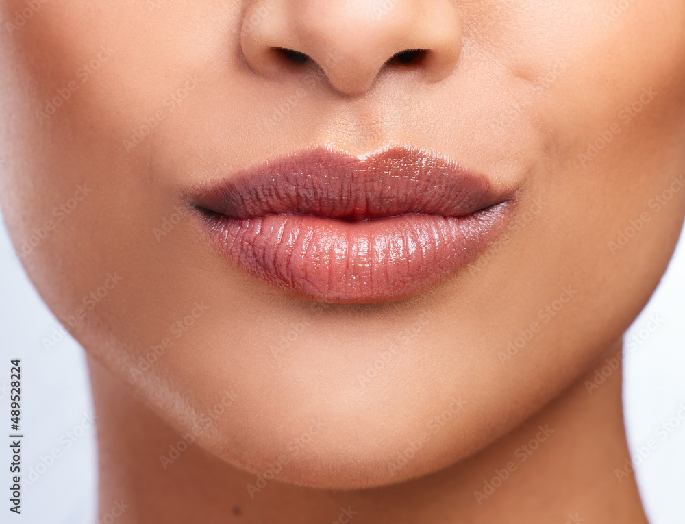 Going against the average. Cropped shot of an unrecognizable womans beautiful full lips. Going against the average. Cropped shot of an unrecognizable womans beautiful full lips.