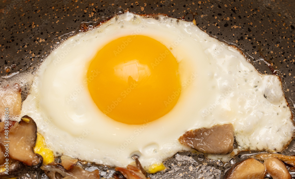 Egg fried in a pan.