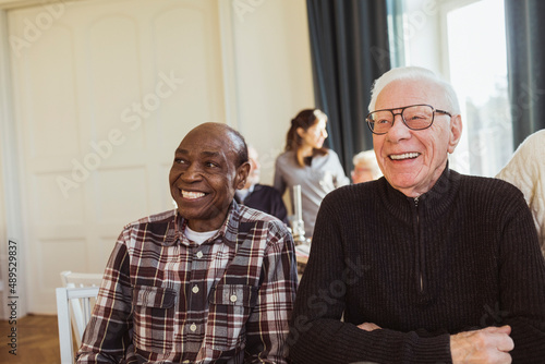 Cheerful senior male friends in nursing home photo