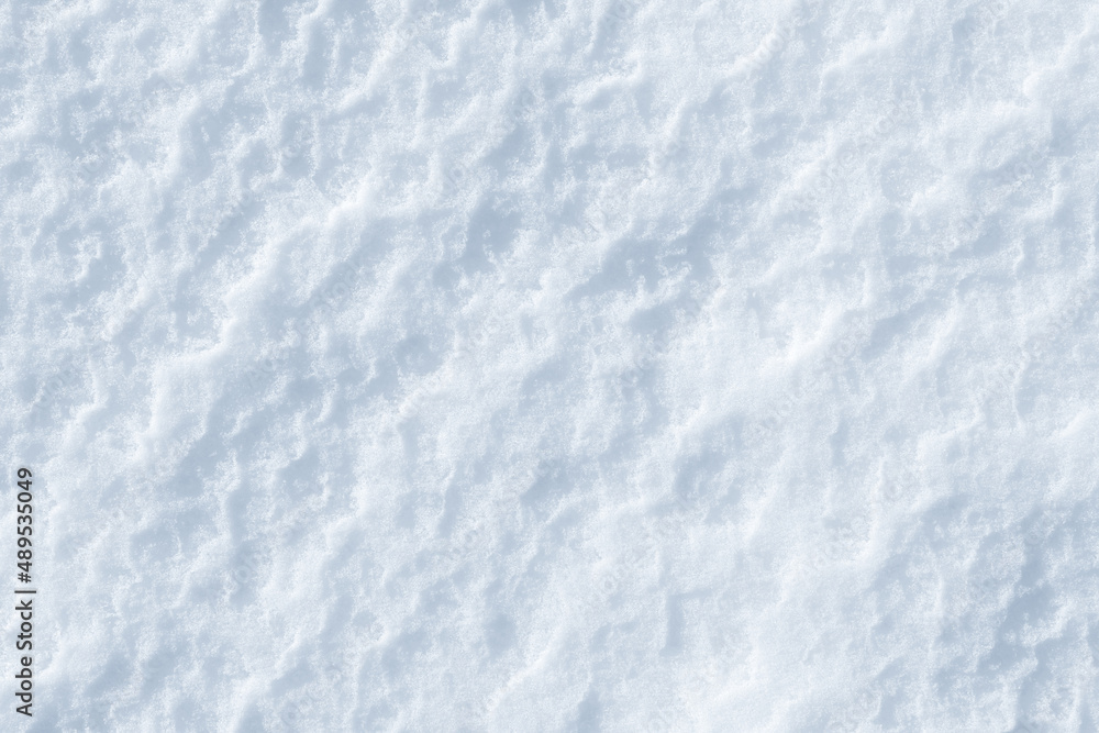 Fresh clean white snow background texture. Winter background with frozen snowflakes and snow mounds. Snow lumps. Seasonal landscape details. Cold weather.