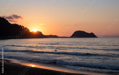 Ratón de Getaria famous landmark at sunset time by the sea, picture taken from Zarautz beach, Basque Country, Guipúzcoa, Spain