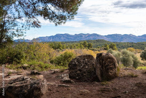 Burial mound made of stones in the countryside, Mas de Toribio near Calaceite, Teruel, Aragon, Spain photo