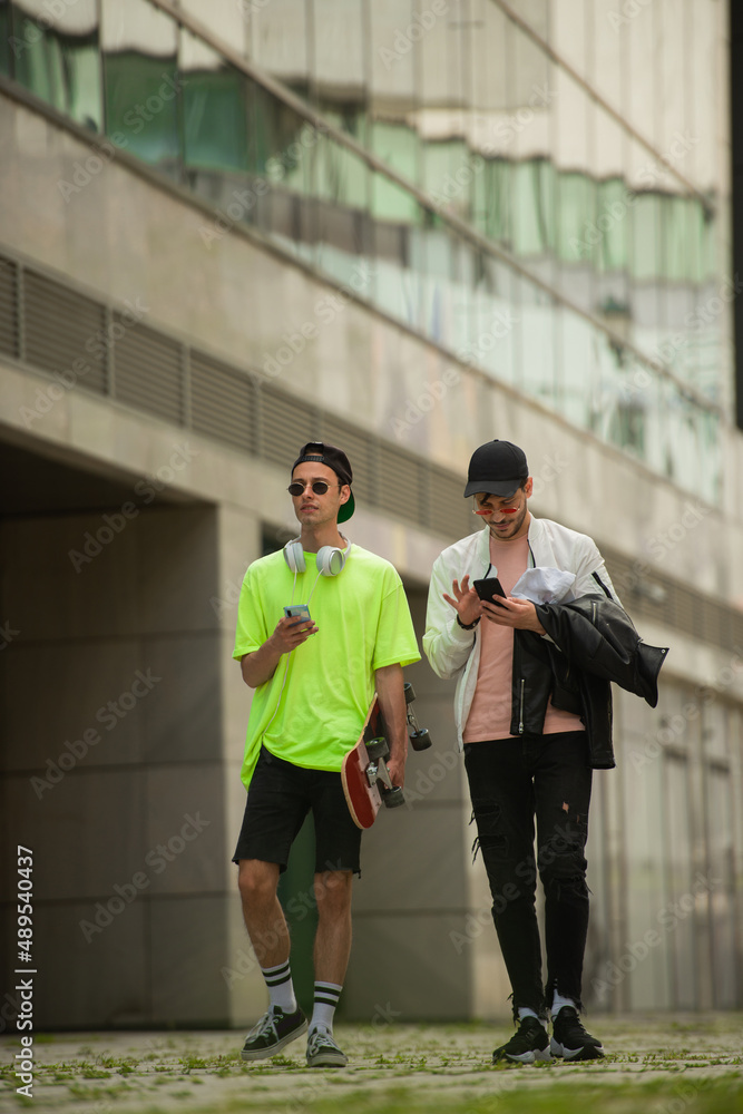 Obraz premium Walking and talking while checking the phones