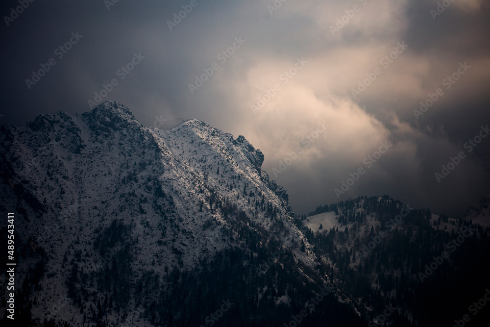 dark mood over the mountain with stormy clouds