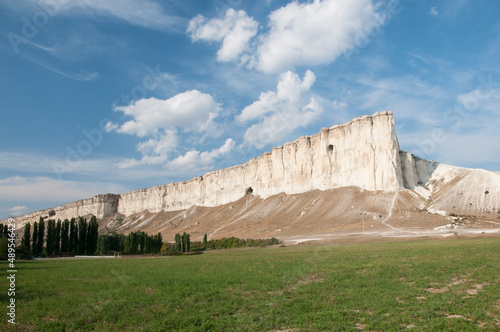 Landscape view of White mountain or Belaya mountain with green field in the foreground  Crimea  Russian Federation