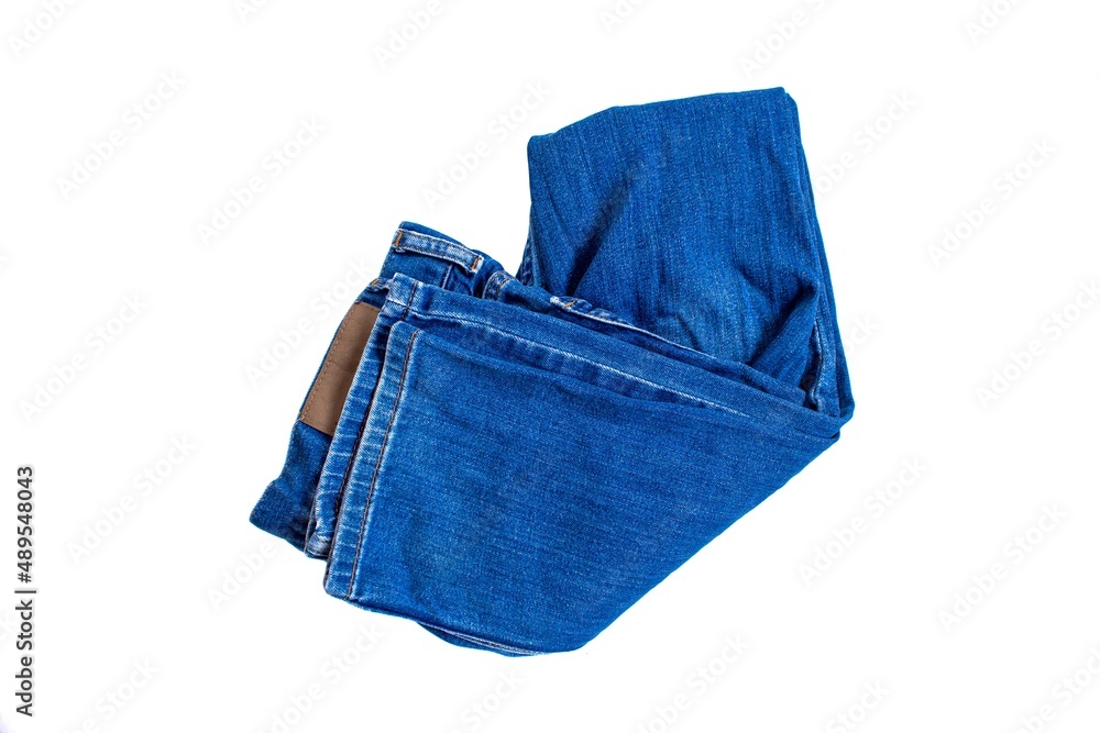 Top view folded blue jeans isolated on white background. Flat lay. Top view folded blue jeans isolated on white background. Flat lay.