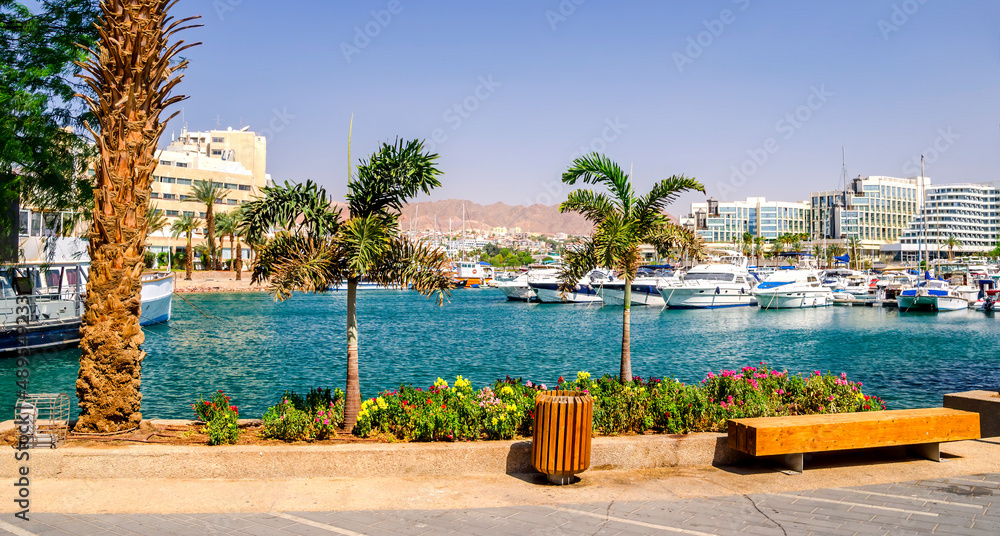 Fototapeta premium Central marina with pleasure tourist, entertainment, fishing and cruise motorboats and resort and vacation hotels for tourist from Israel and all outdoors