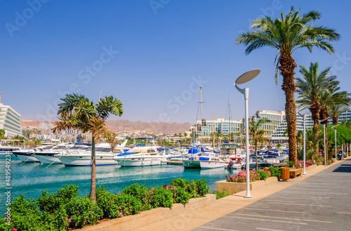 Central marina with pleasure tourist, entertainment, fishing and cruise motorboats and resort and vacation hotels for tourist from Israel and all outdoors