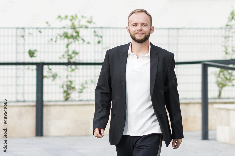 Businessman. Positive mood. Modern environment and architecture. Young man. Businessman. Positive mood. Modern environment and architecture. Young man.