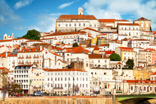 View of the city of Coimbra at the golden hour. View of the left bank of the Mondego River. 