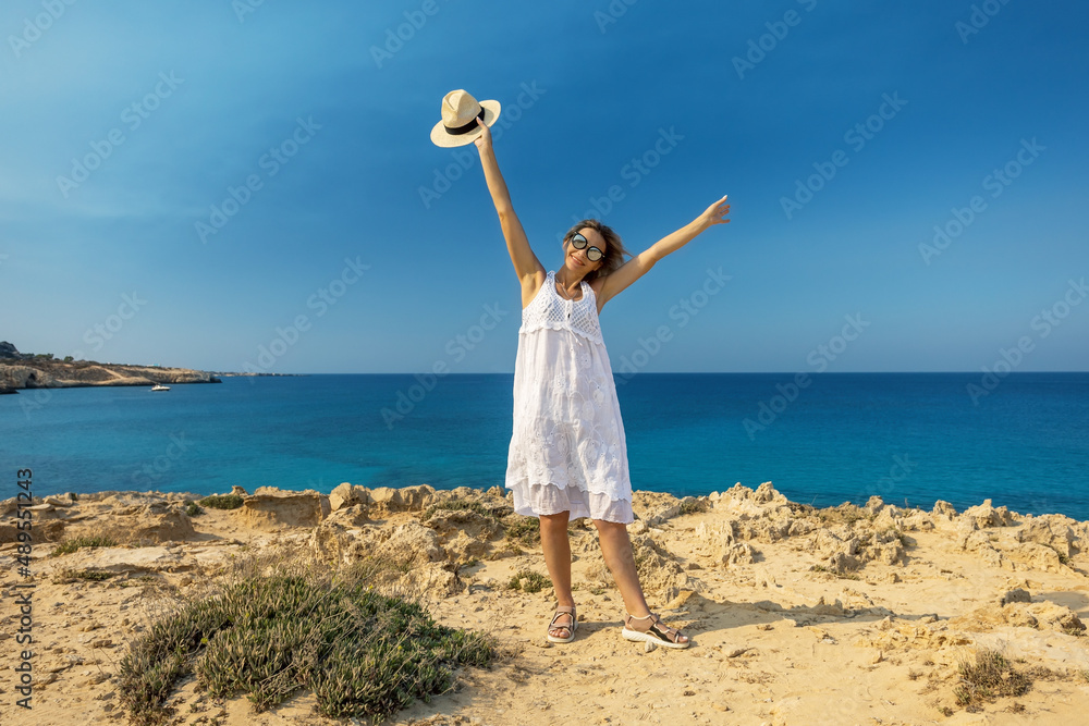 Happy woman smiling at the beach enjoying summer vacation. Happy woman smiling at the beach enjoying summer vacation.