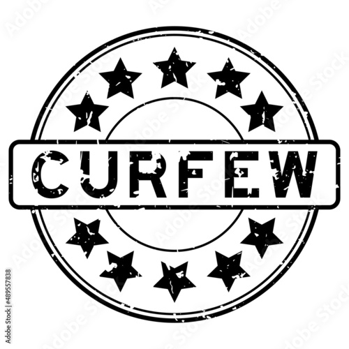 Grunge black curfew word with star icon round rubber seal stamp on white background