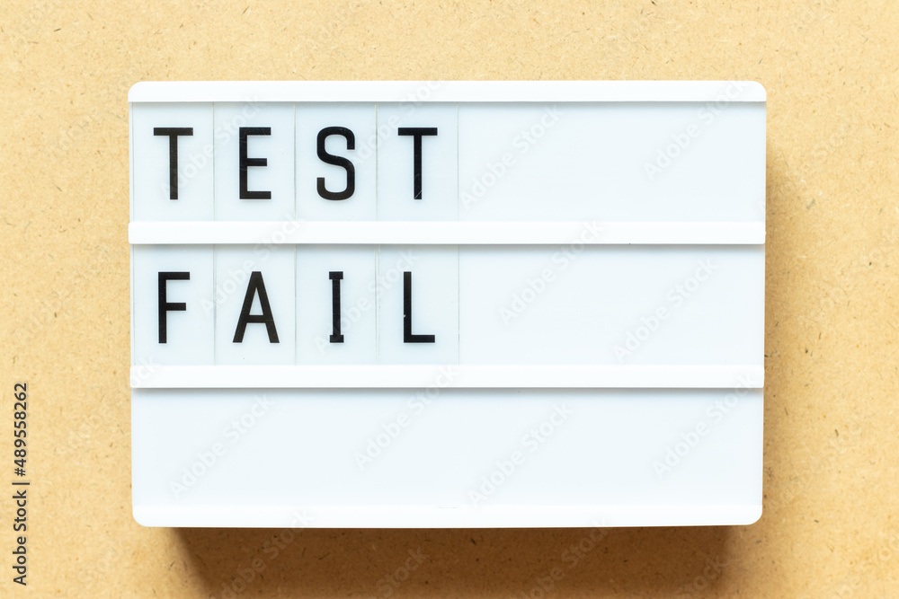 Lightbox with word test fail on wood background Lightbox with word test fail on wood background