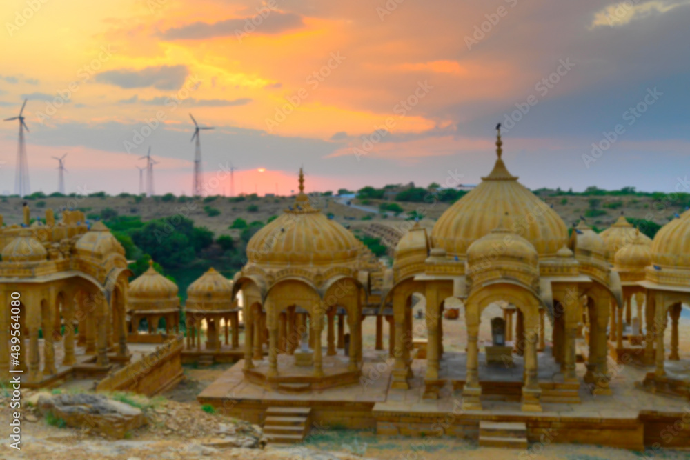 Obraz premium Blurred image of beautiful sunset at Bada Bagh or Barabagh, means Big Garden,is a garden complex in Jaisalmer, Rajasthan, India, Royal cenotaphs for memories of Kings of Jaisalmer state.
