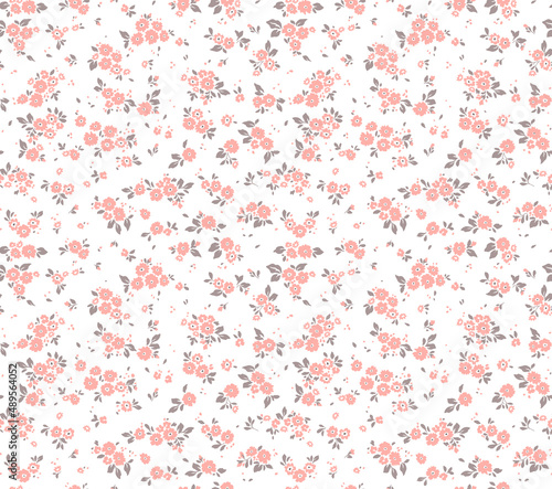 Spring flowers print. Vector seamless floral pattern. Floral design for fashion prints. Endless print made of small pastel pink flowers. Elegant template. White background. Stock vector.