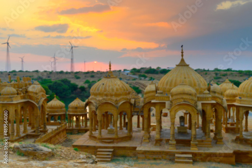 Blurred image of beautiful sunset at Bada Bagh or Barabagh, means Big Garden,is a garden complex in Jaisalmer, Rajasthan, India, Royal cenotaphs for memories of Kings of Jaisalmer state. © mitrarudra