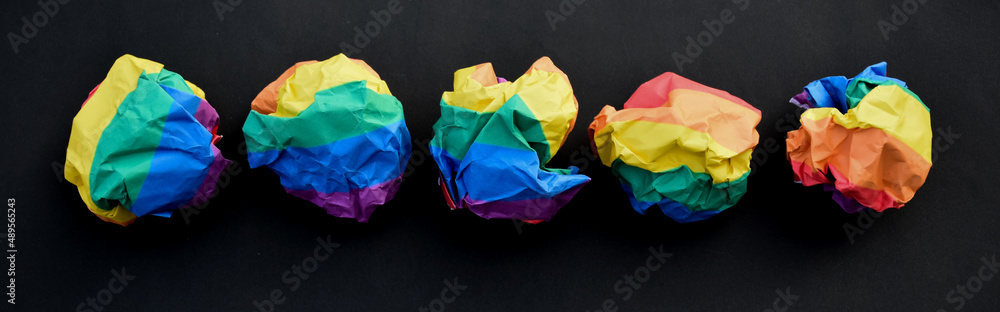 Paper balls made of wringled rainbow colored paper, concept for lgbtq+ communities celebrations in pride month around the world. Paper balls made of wringled rainbow colored paper, concept for lgbtq+ communities celebrations in pride month around the world.
