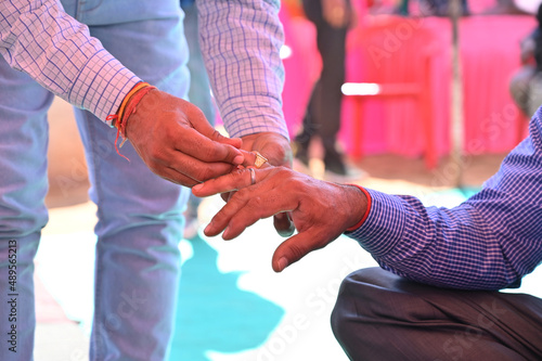 man wearing ring from his relative in Indian wedding 