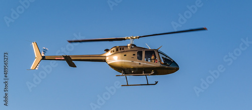 Helicopter Flying Over Blue Sky photo