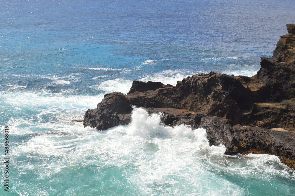 waves breaking on rocks