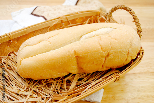 A Single Loaf of Fresh Bread Left in a Rustic Breadbasket