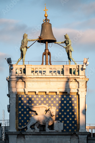 Saint Mark's Clocktower or Torre dellOrologio in Venice, Italy with Moors Striking the Hour on a Bell and Winged Lion photo
