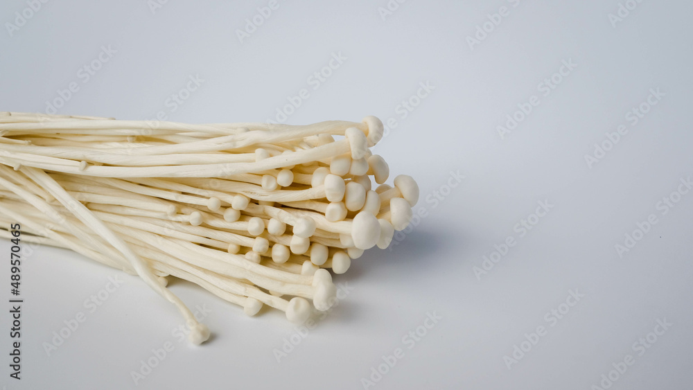 Enoki mushroom, Golden needle mushroom isolated on white backgro Enoki mushroom, Golden needle mushroom isolated on white backgro