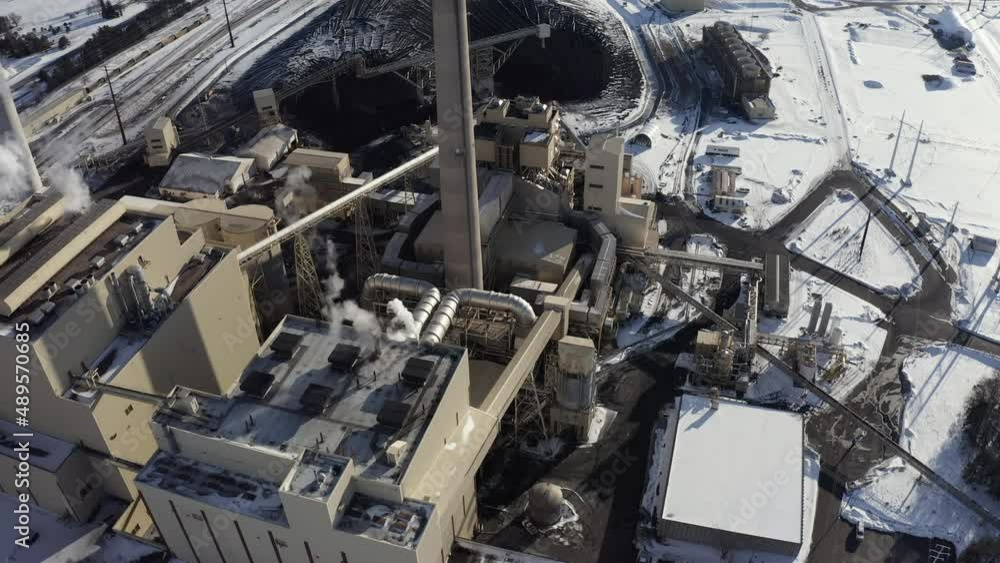 Aerial view of Coal fired electrical power station on sunny winter day. Industry concept