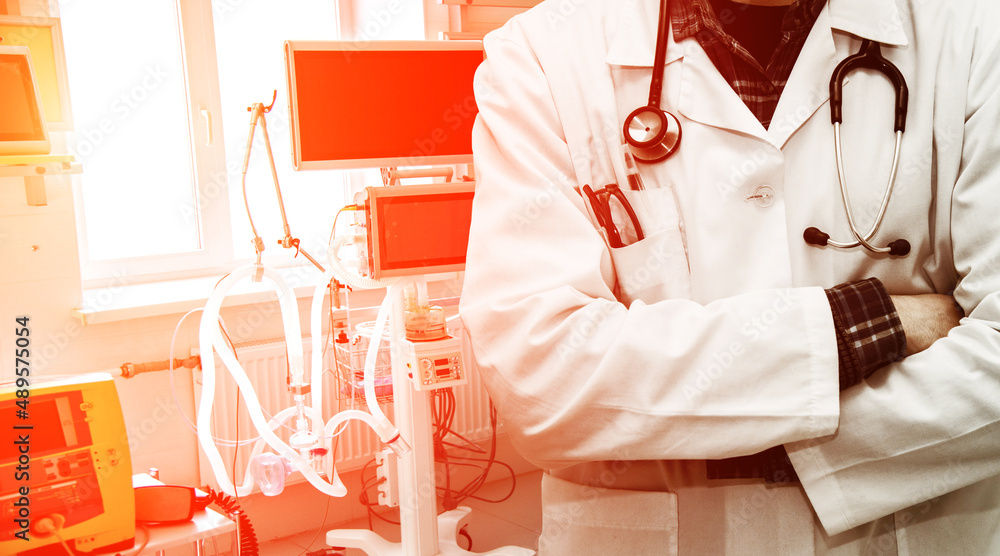Abstract image of doctor in a white coatDoctor on the background of resuscitation equipment and bright optimistic sunlight (rescue - concept)