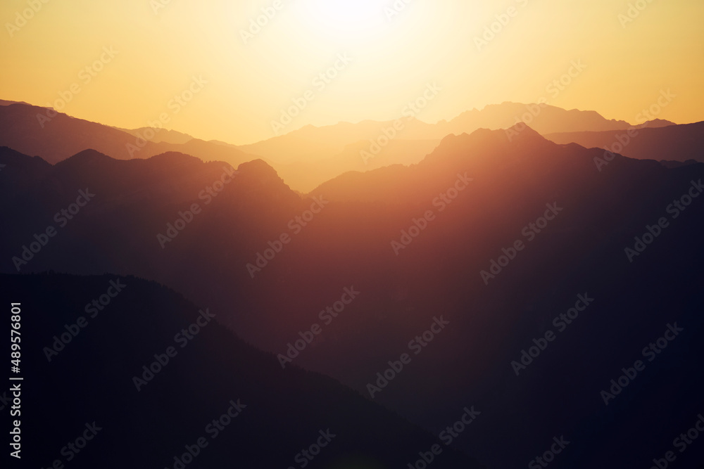 sunset in the mountains with lens glare