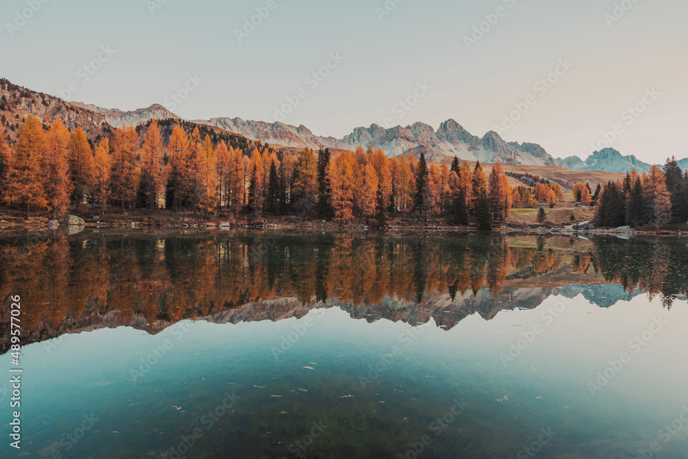 autumn sunrise by the lake in the mountains 